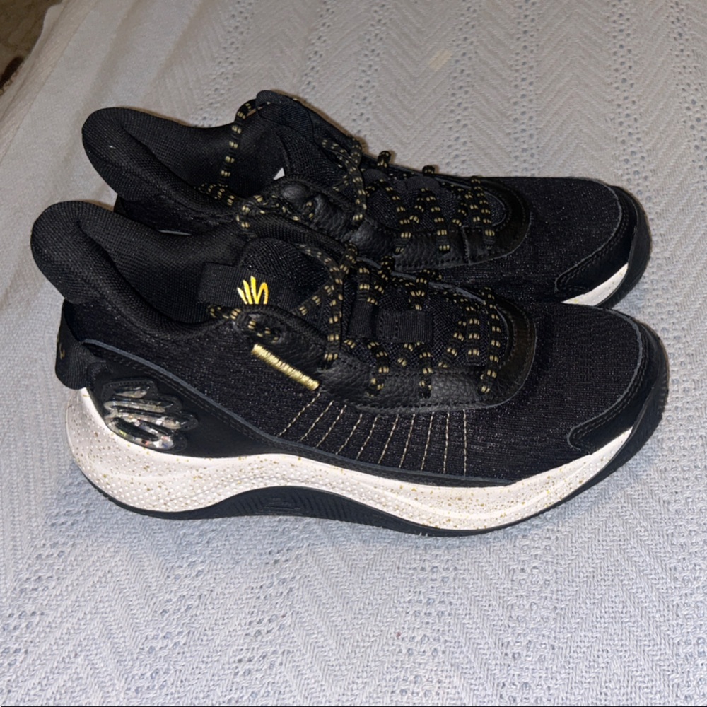 Black and Gold Curry basketball shoes worn for one season